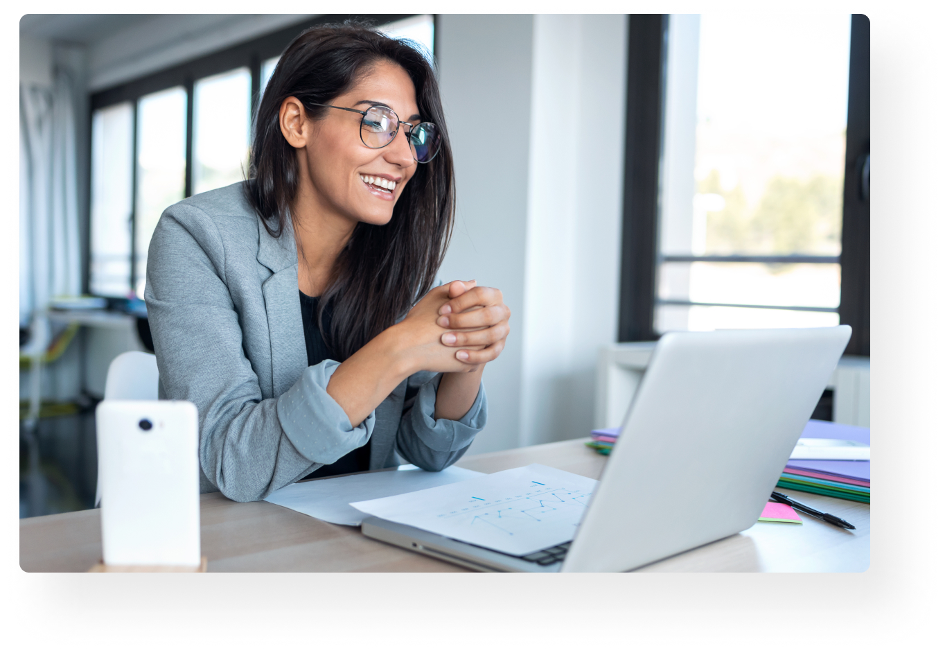 woman smiling at laptop